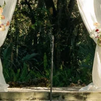 Outdoor wedding ceremony setup with floral decorations