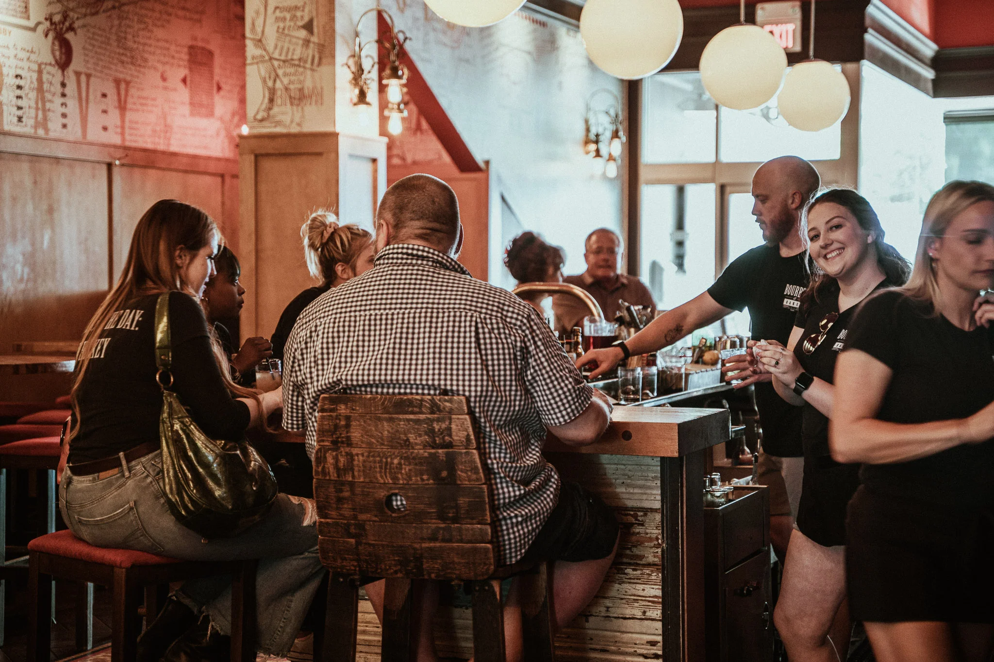 Cozy bar scene with patrons enjoying drinks and friendly staff