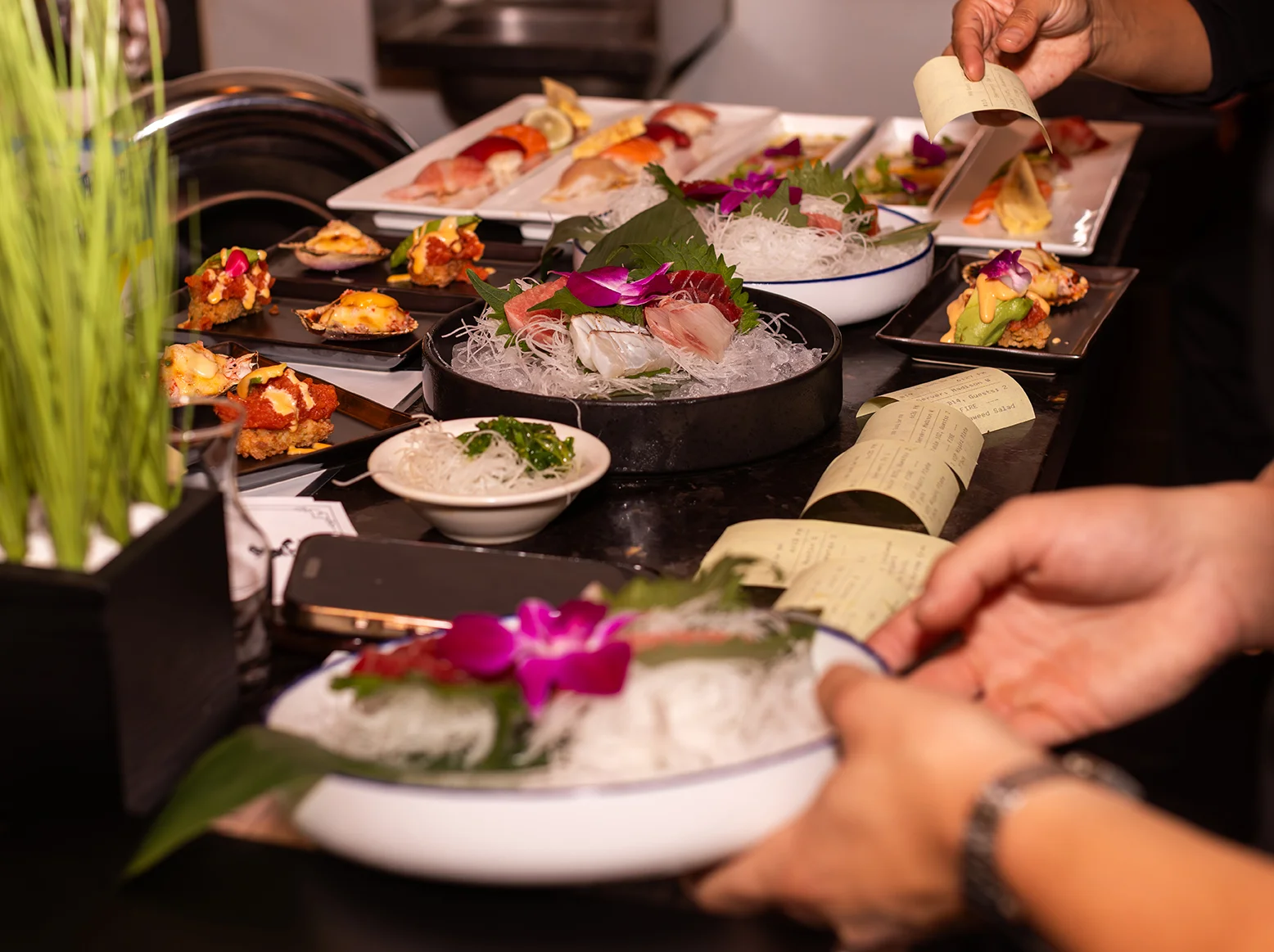 Assorted Japanese sushi platter with fresh sashimi and garnishes