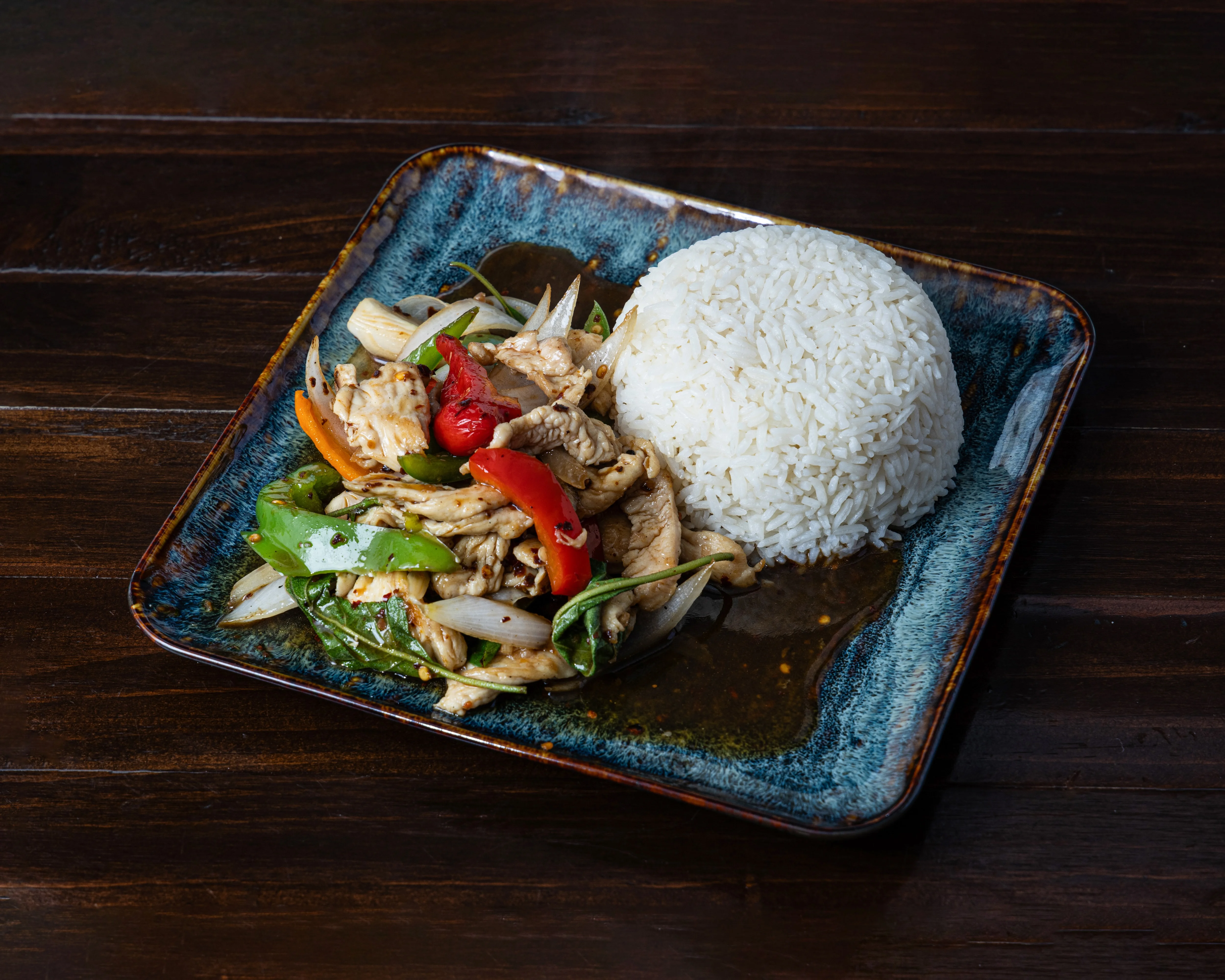 Plate of Pad Thai from Saoho Thai Cuisine with vibrant colors and garnishes.