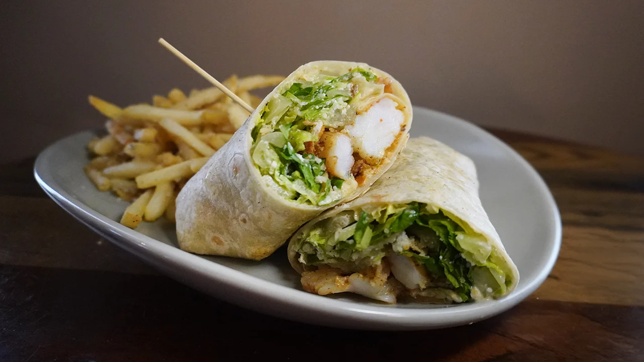 Crispy shrimp wrap with lettuce and fries