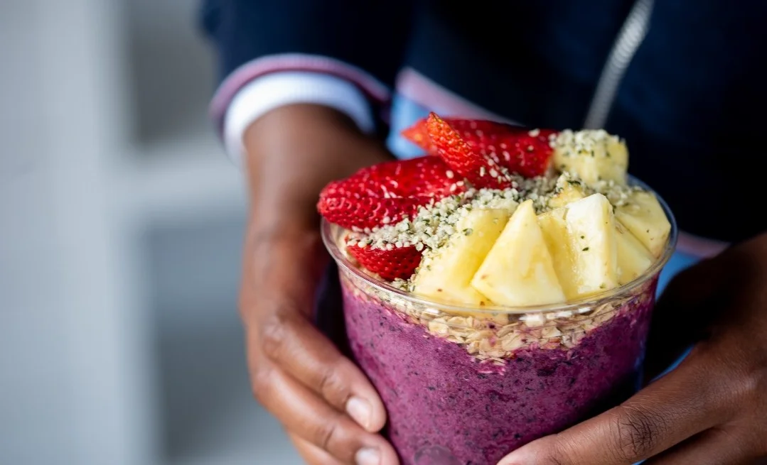 Colorful acai bowl topped with fresh fruit