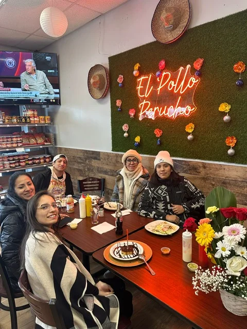 Cozy dining area at El Pollo Perucho with friends enjoying a meal