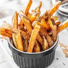 Crispy Belgian-style fries in a black bowl
