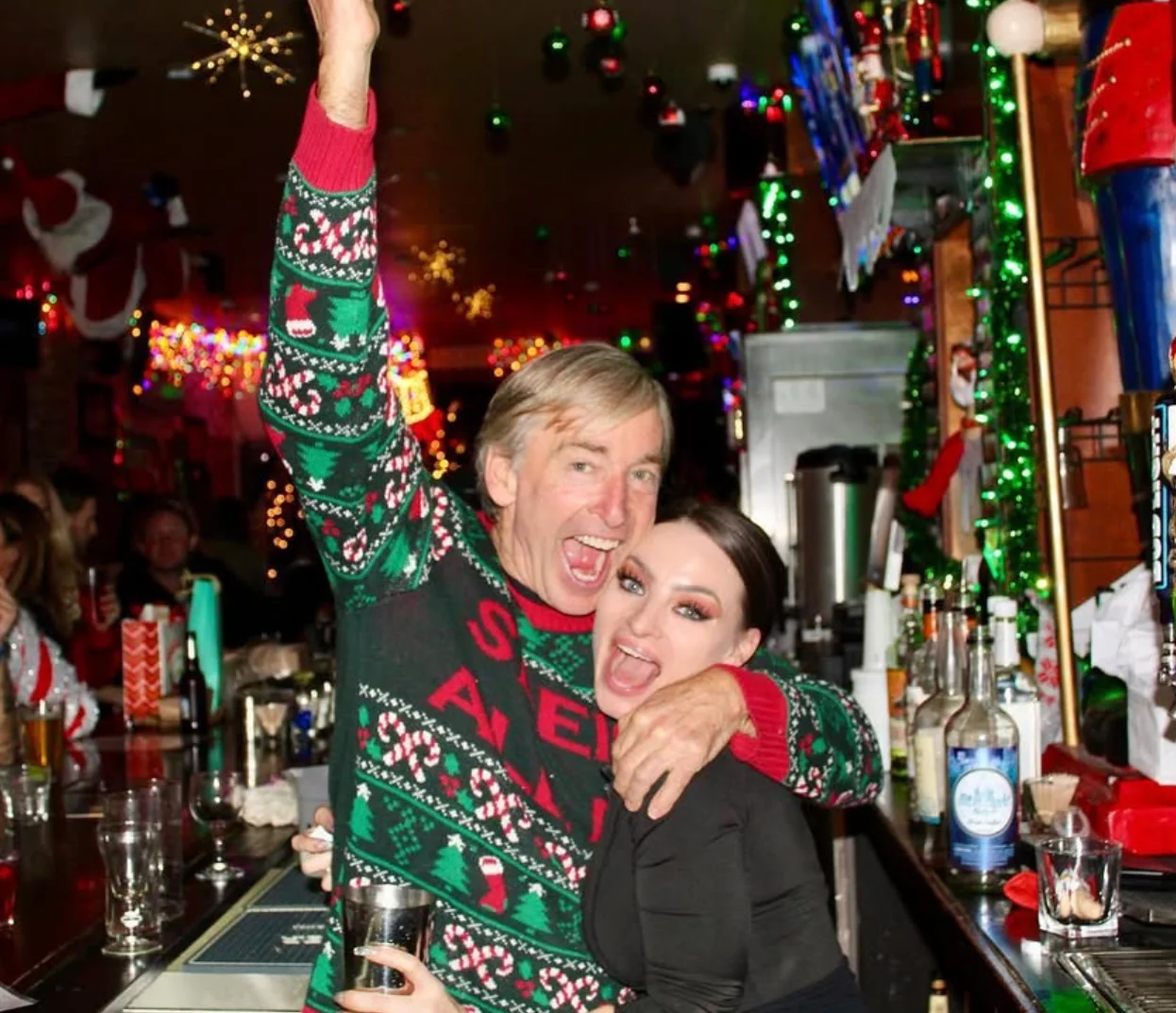 Festive bar scene with joyful patrons celebrating the holidays