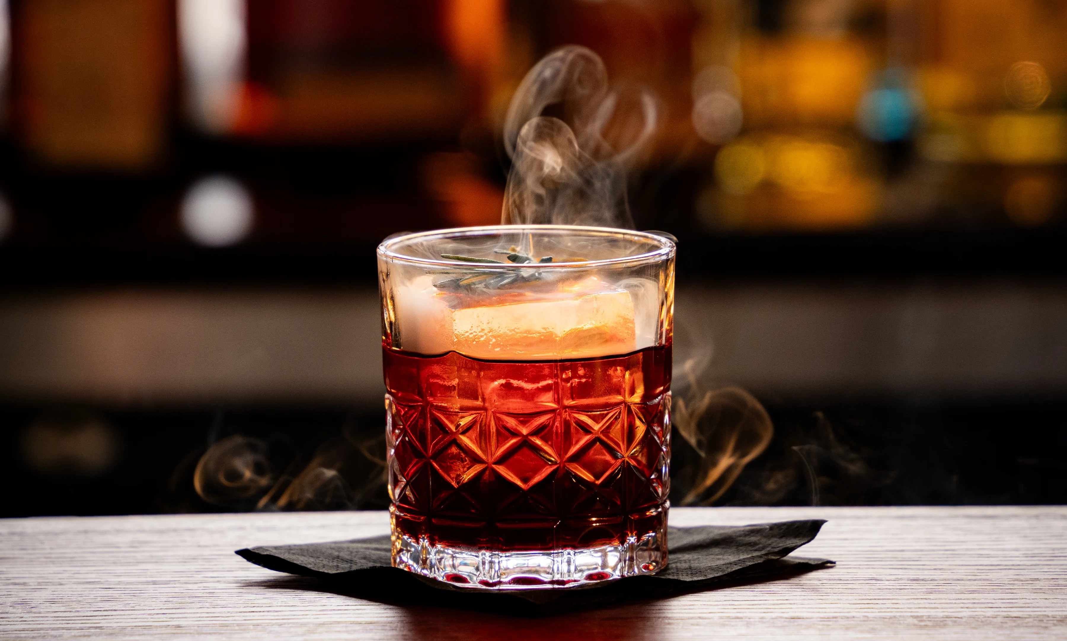 Smoky cocktail served in a crystal glass