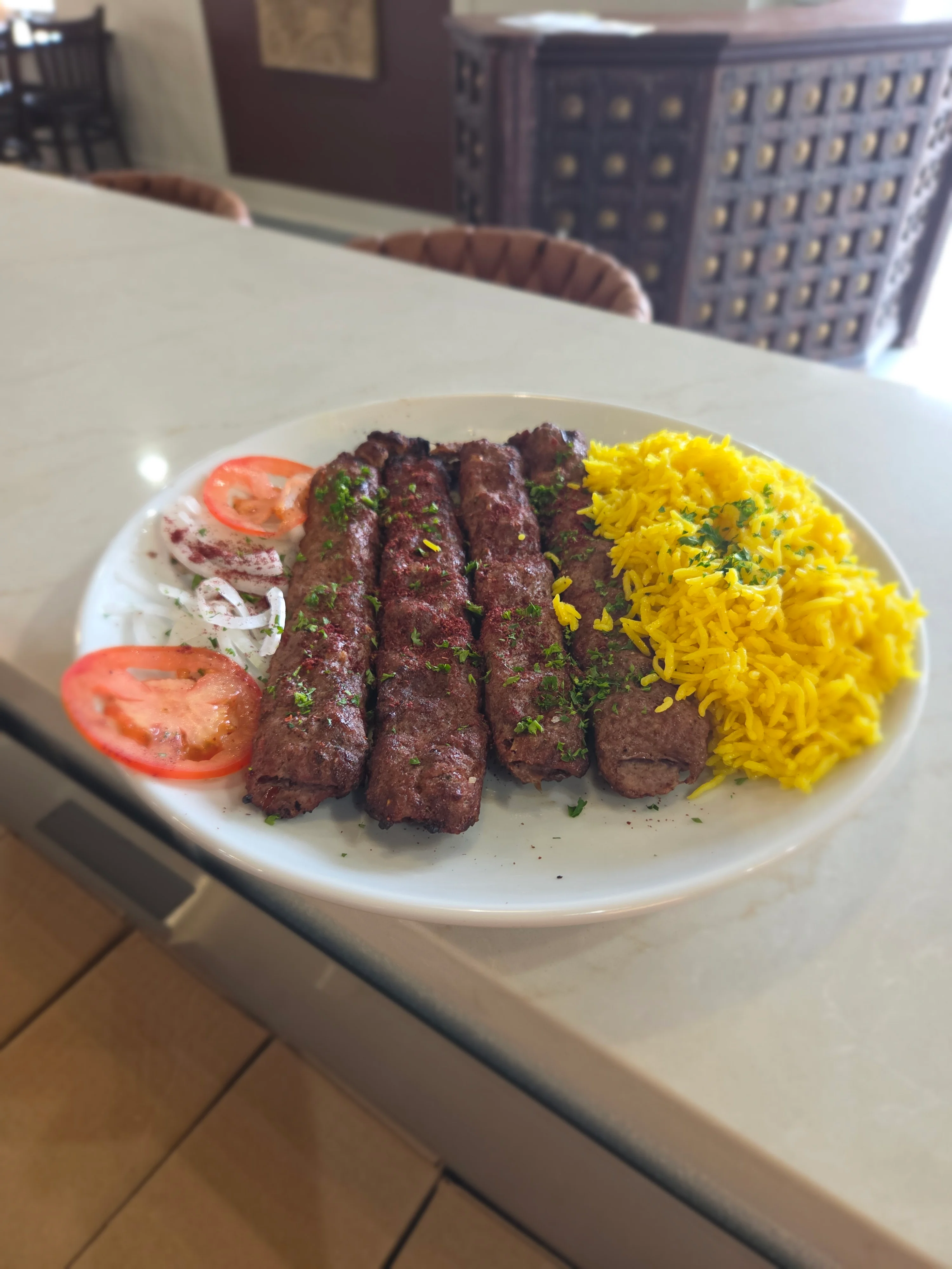 Grilled kebabs served with saffron rice