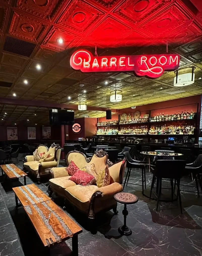 Stylish bar interior with cozy seating and vibrant lighting