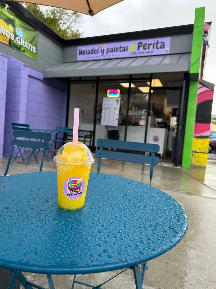 Refreshing mango raspado served at a vibrant ice cream shop