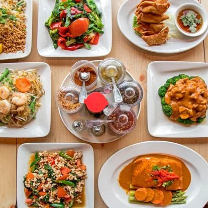 Assorted Thai dishes including pad thai and curry