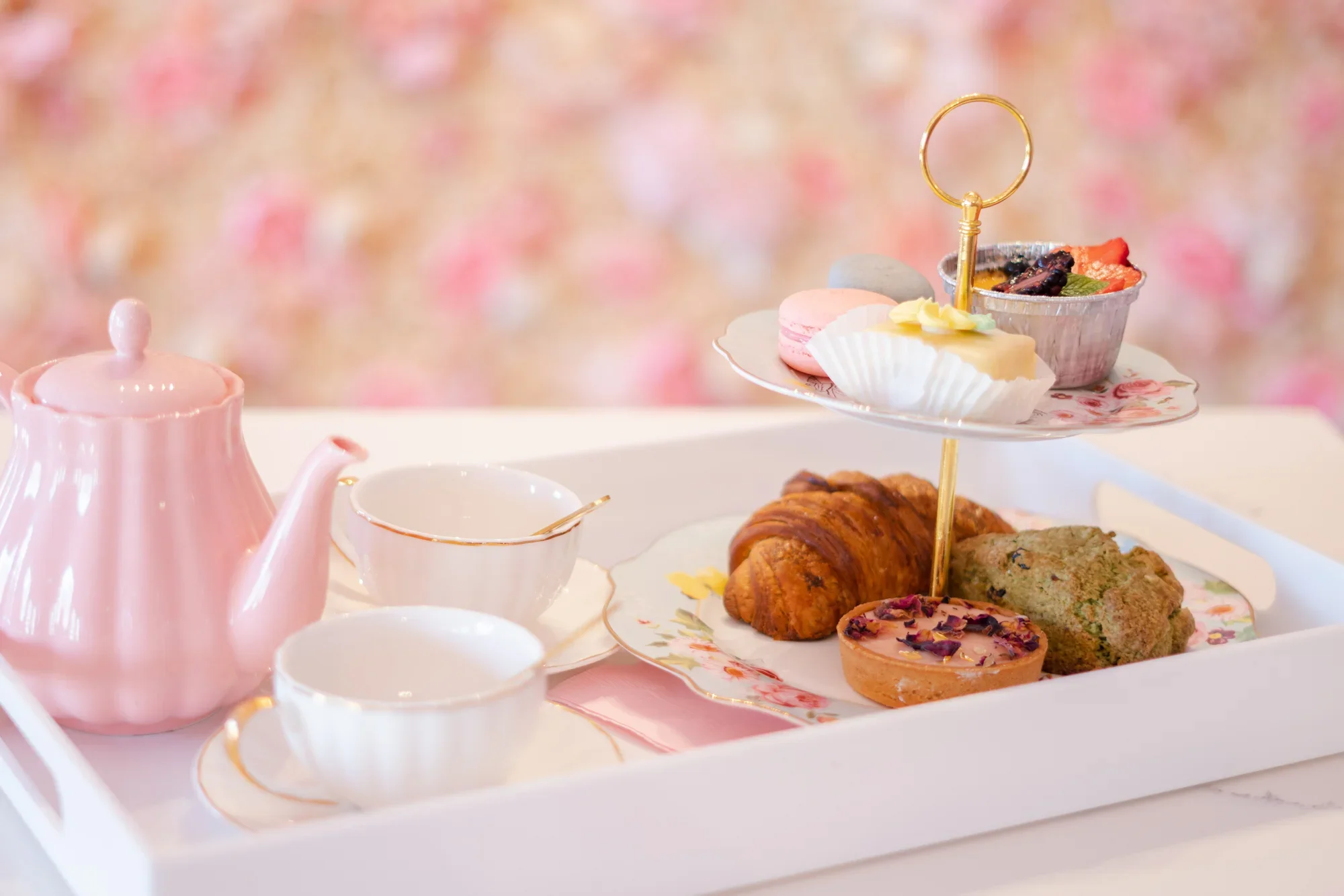 Elegant afternoon tea set with pastries and tea
