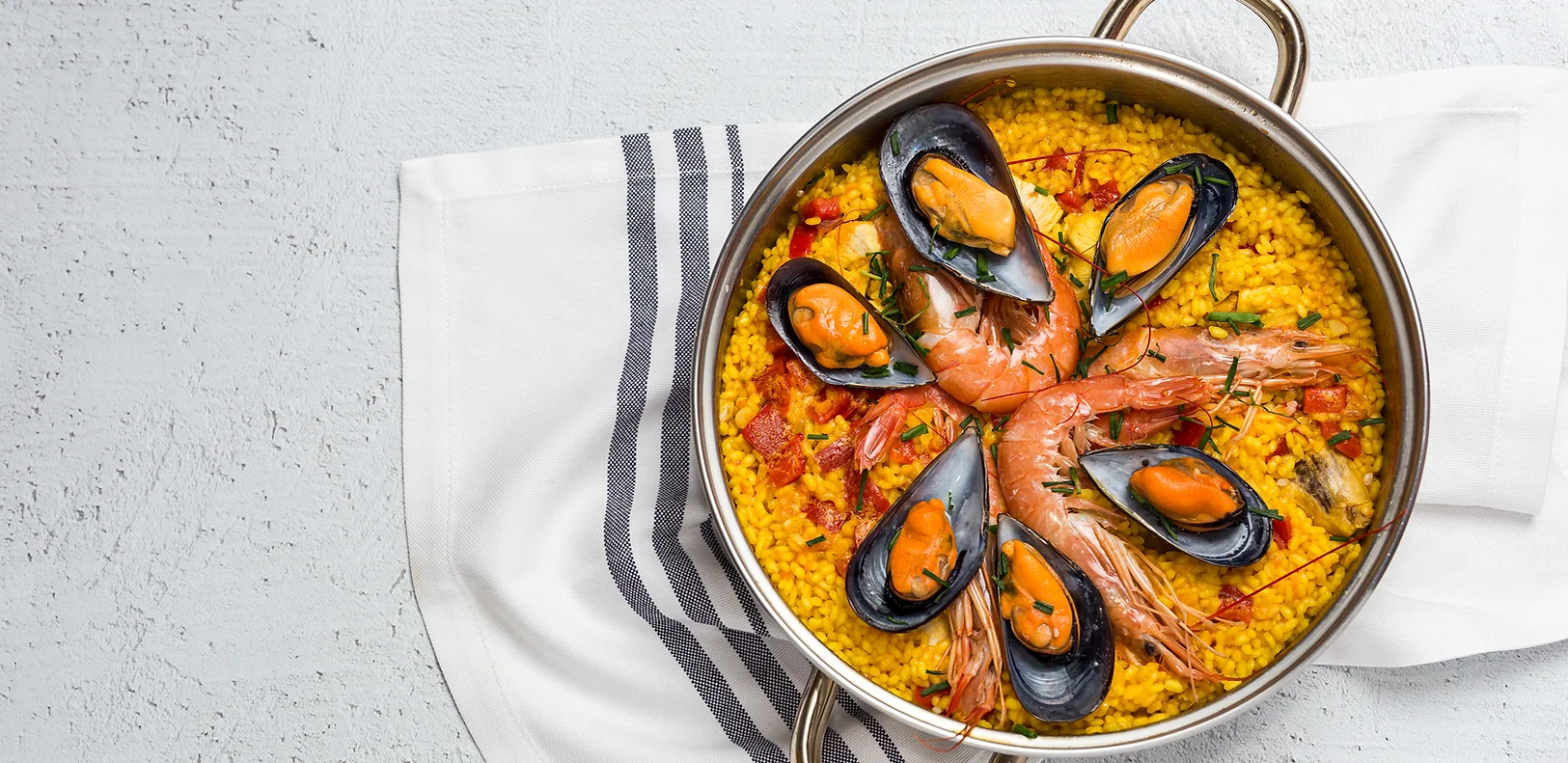 Traditional Spanish paella with seafood and saffron rice