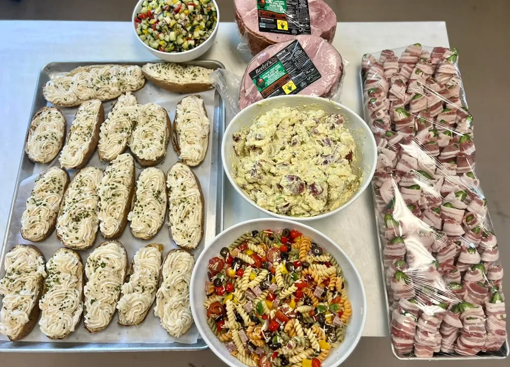 Assorted appetizers including potato salad and pasta salad