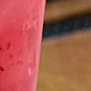 Three colorful cocktails on a bar counter