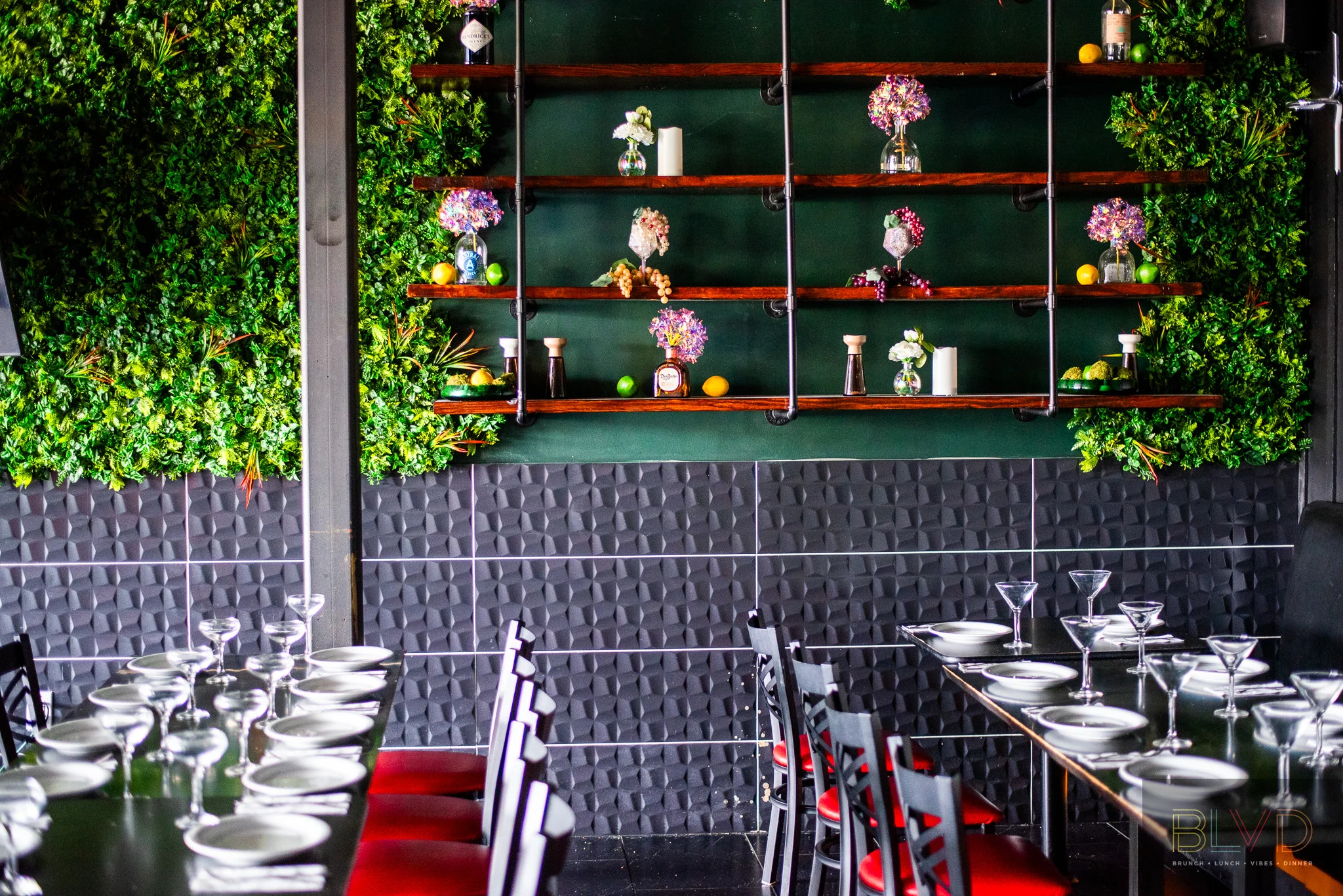 Stylish restaurant interior with greenery and elegant table settings