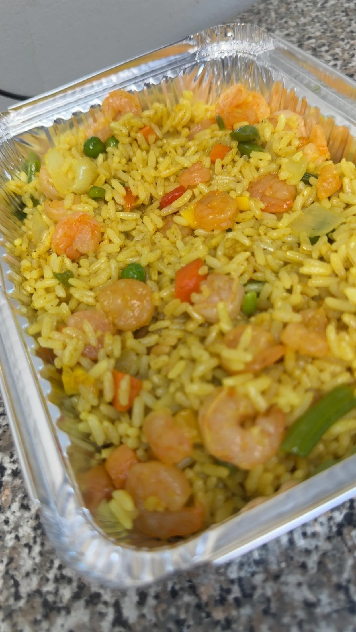 Shrimp fried rice in a takeout container