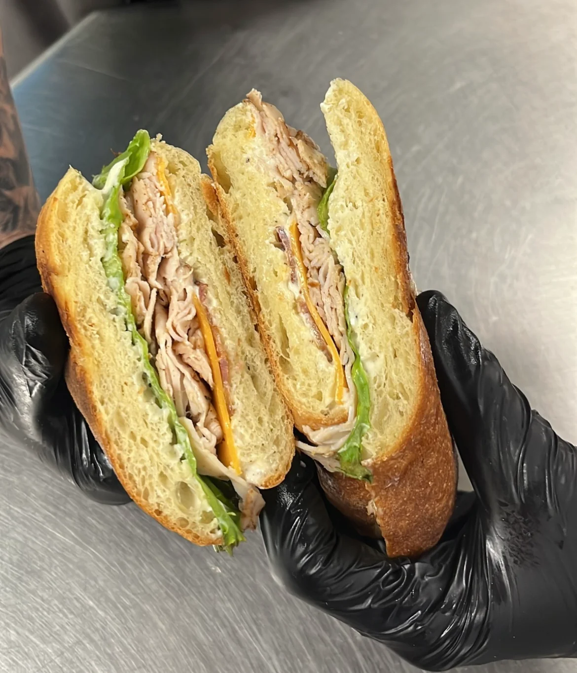 Turkey sandwich on artisan bread with lettuce and cheese