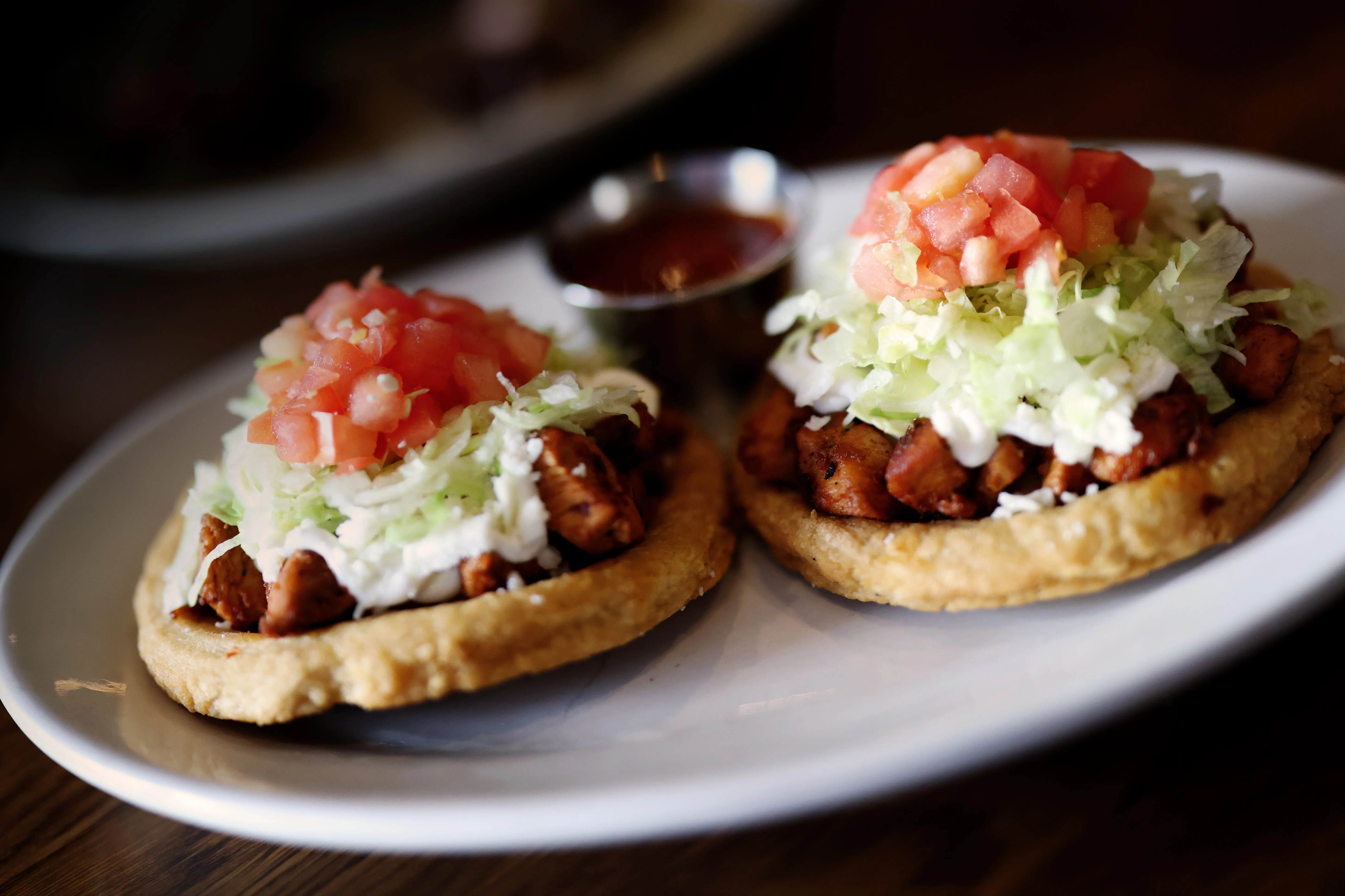 Delicious Mexican tostadas topped with chicken and fresh vegetables