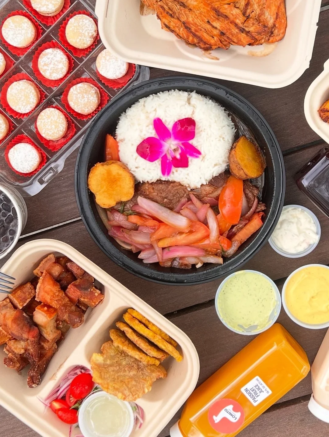 Delicious Peruvian pollo a la brasa with sides and drinks