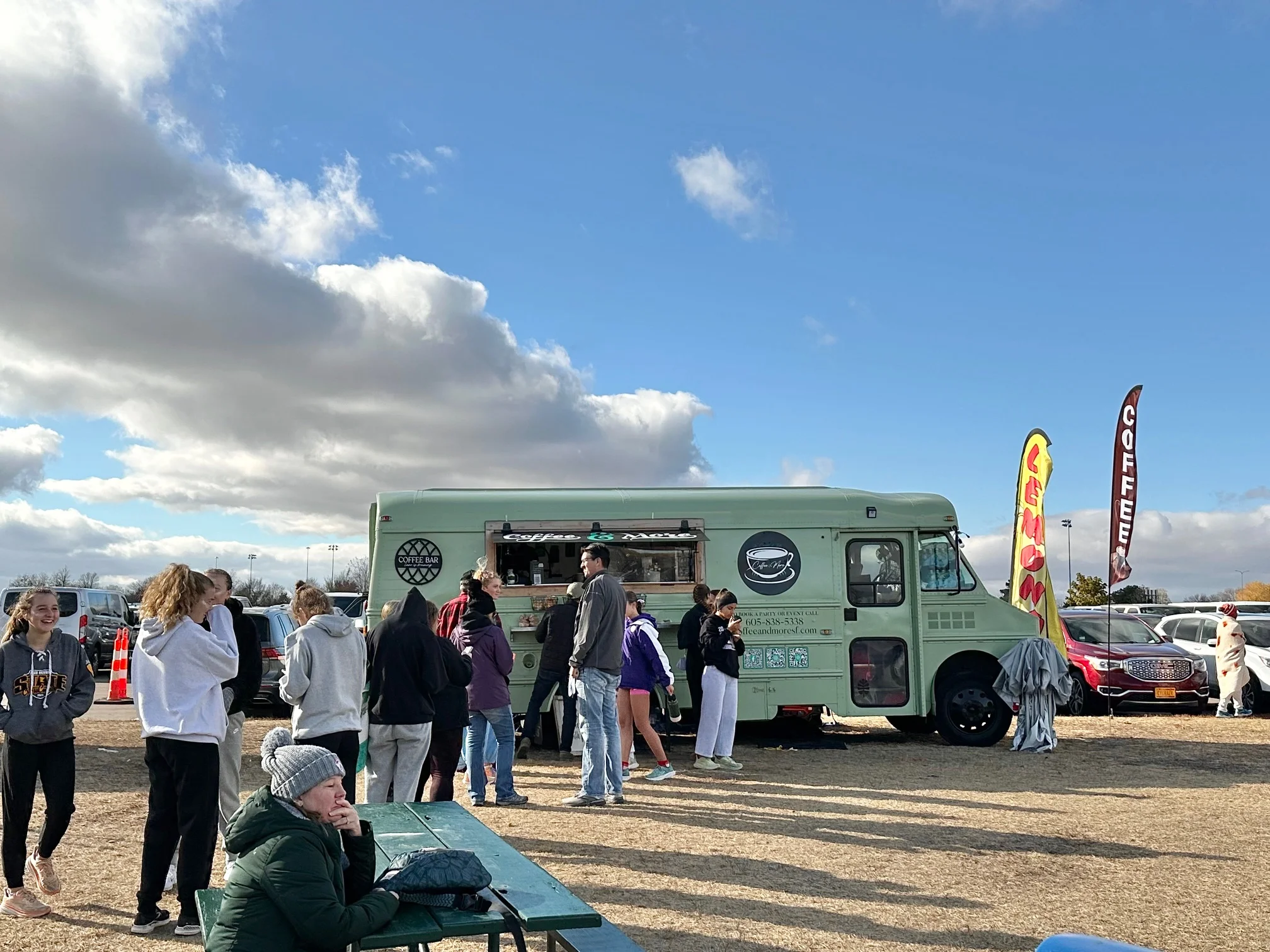 Coffee truck serving customers at an outdoor event