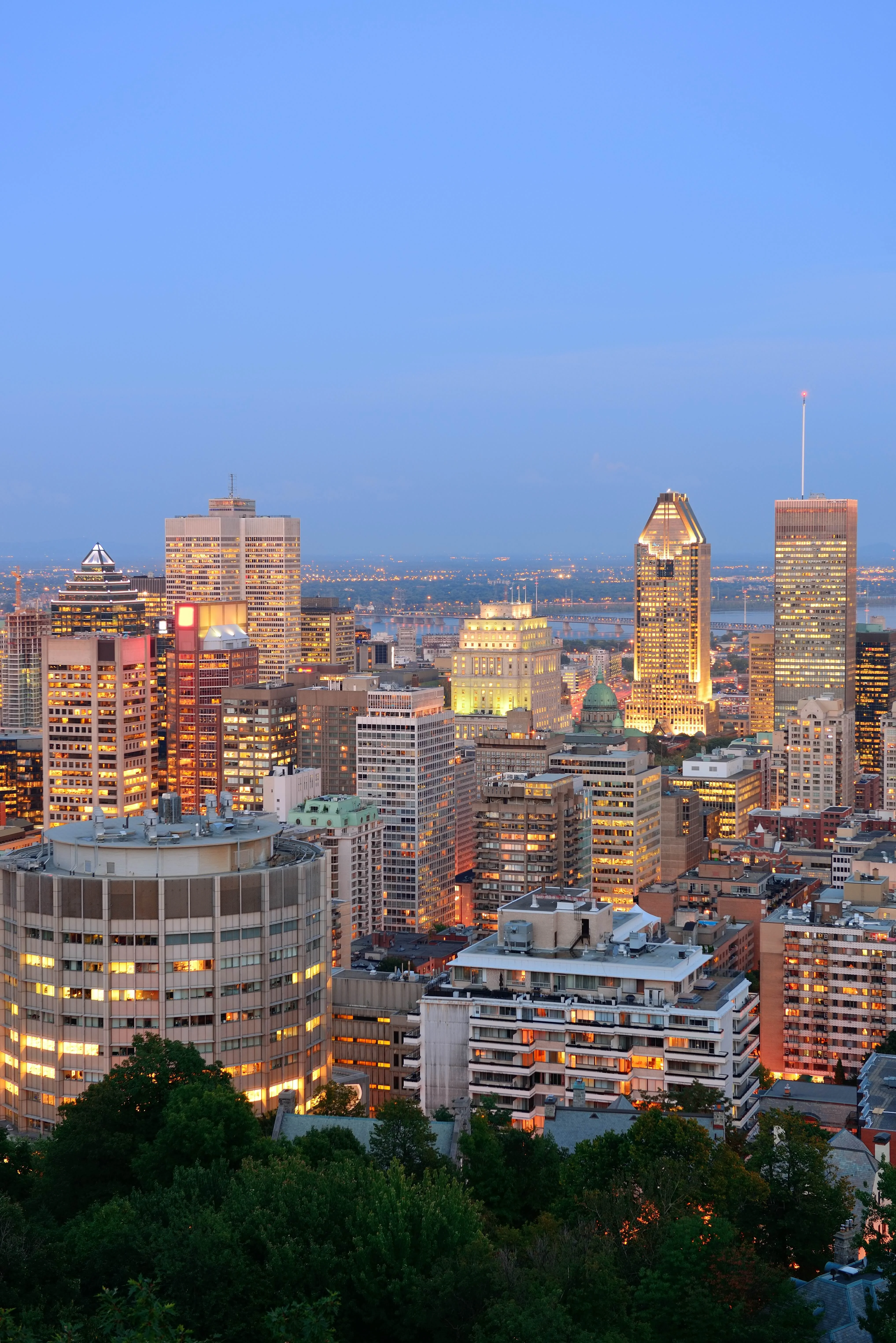 Montreal city skyline at dusk with illuminated buildings