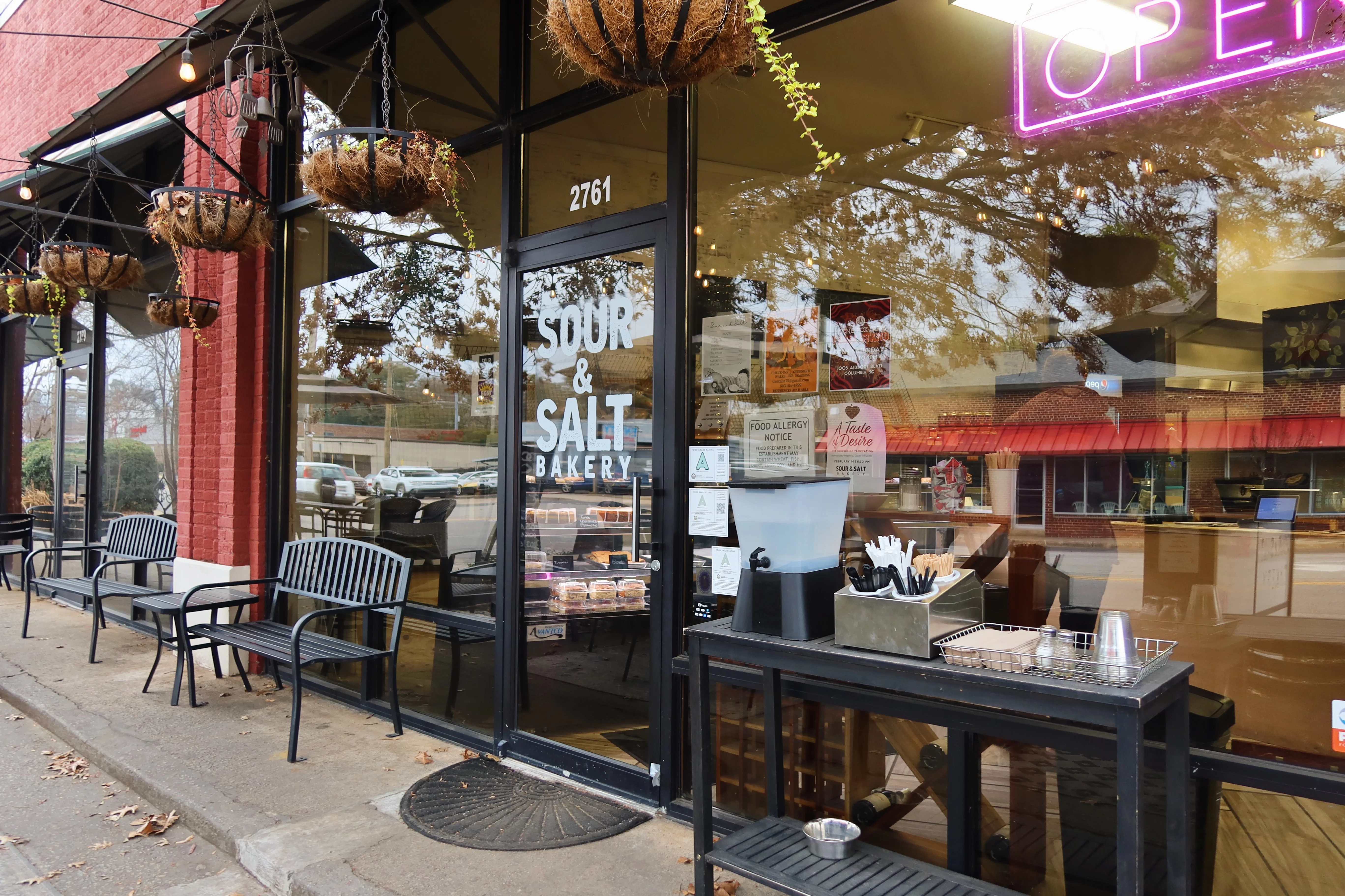 Charming bakery entrance with outdoor seating