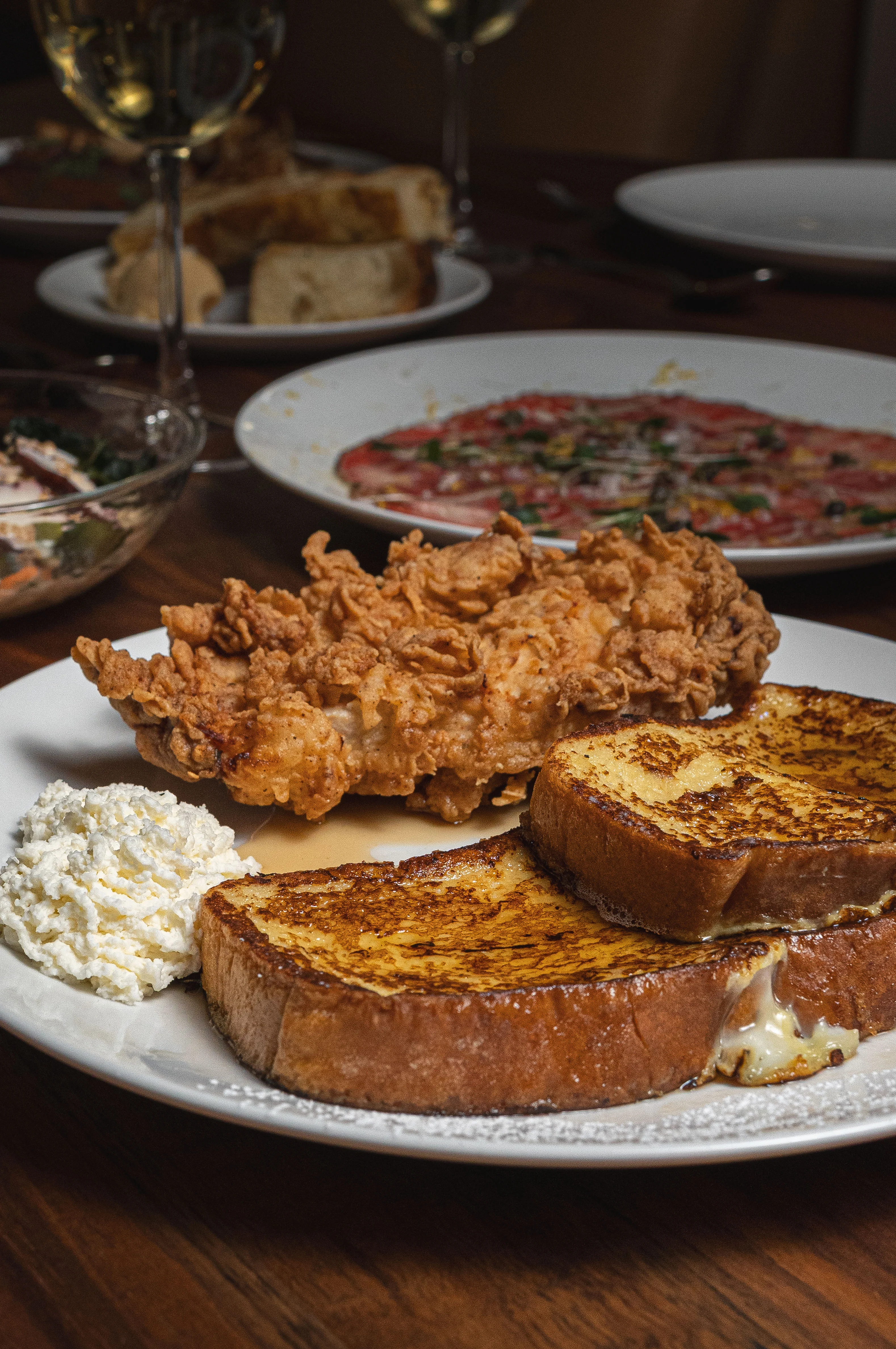 Southern fried chicken with French toast and whipped cream