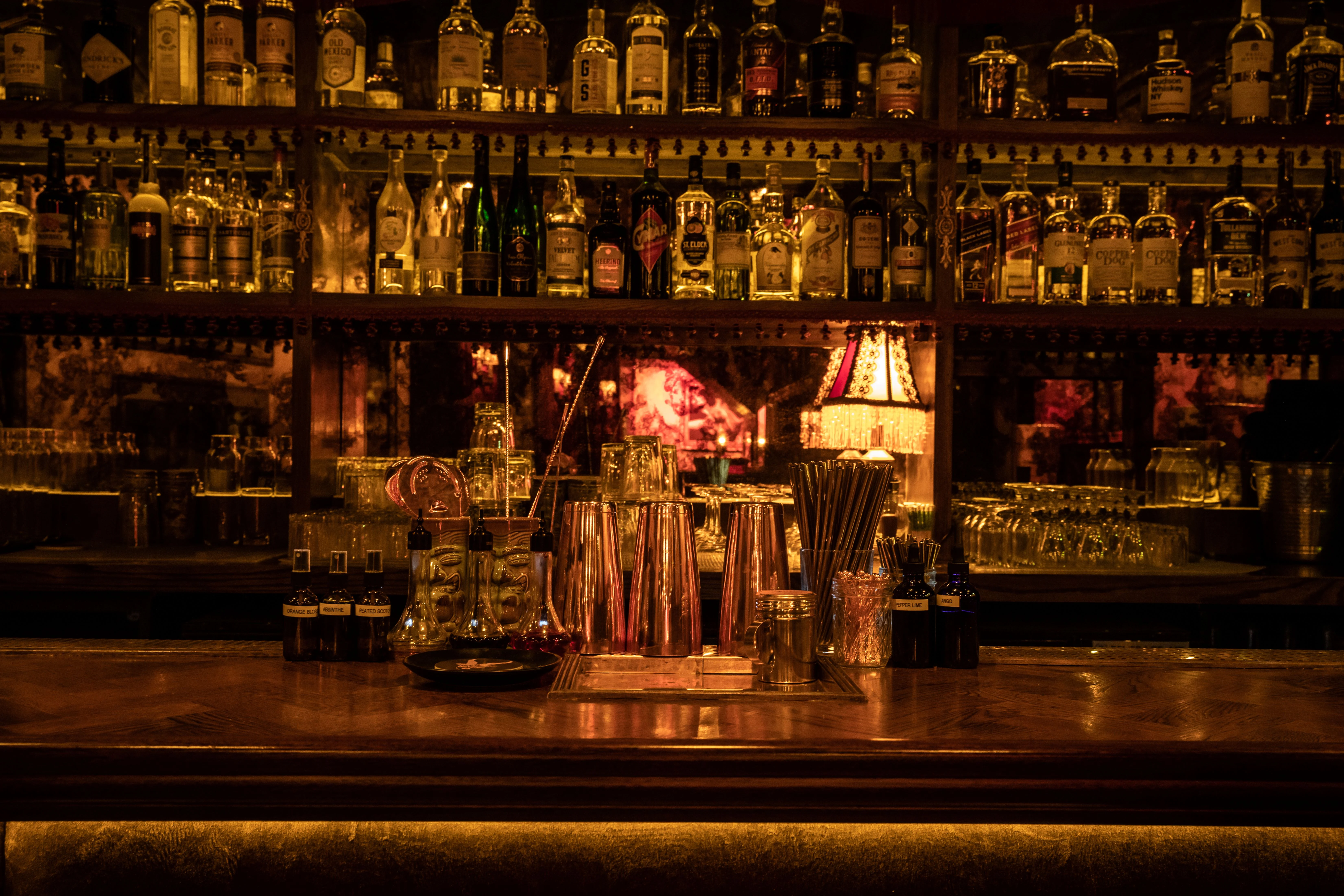 Elegant bar counter with various spirits and cocktail tools