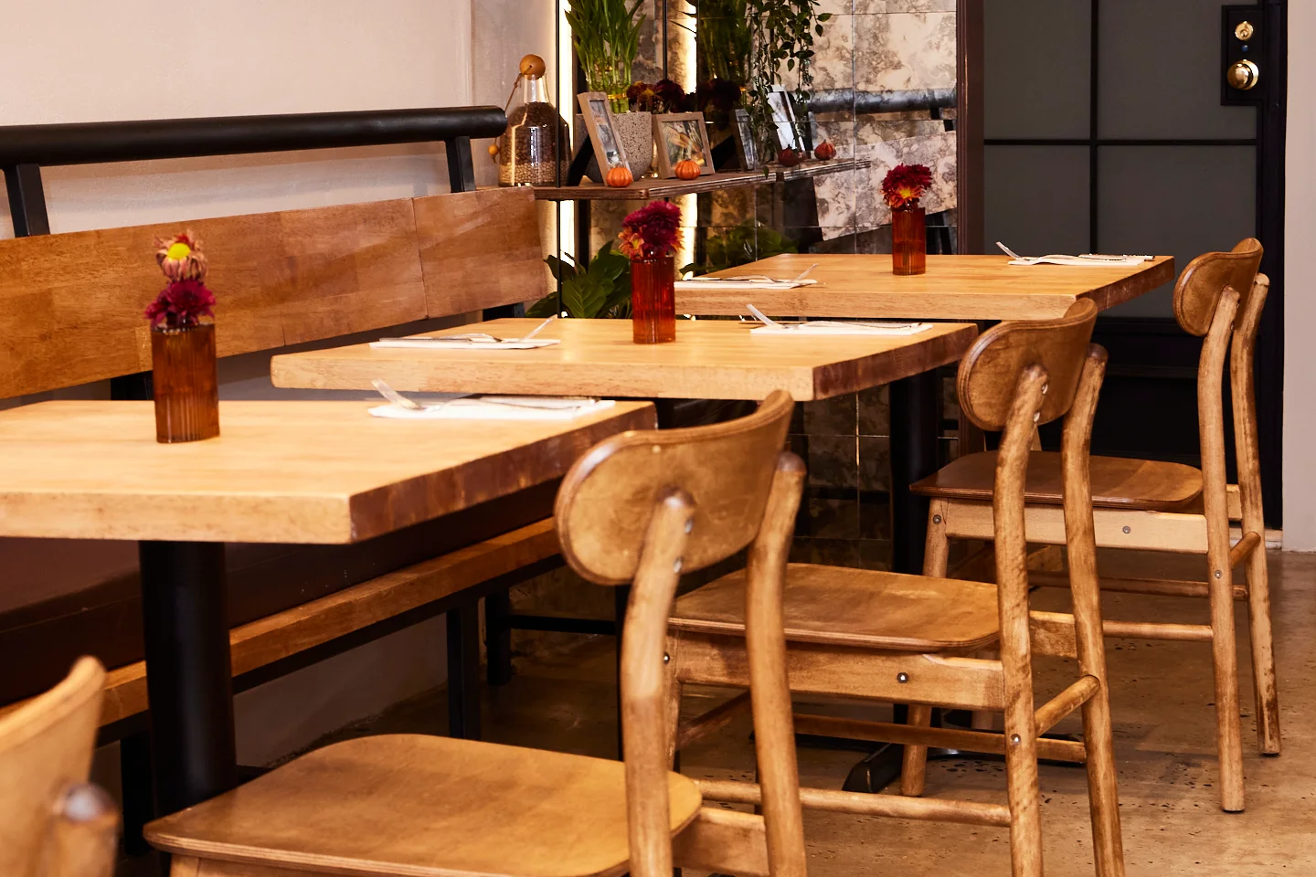 Cozy restaurant interior with wooden tables and warm lighting