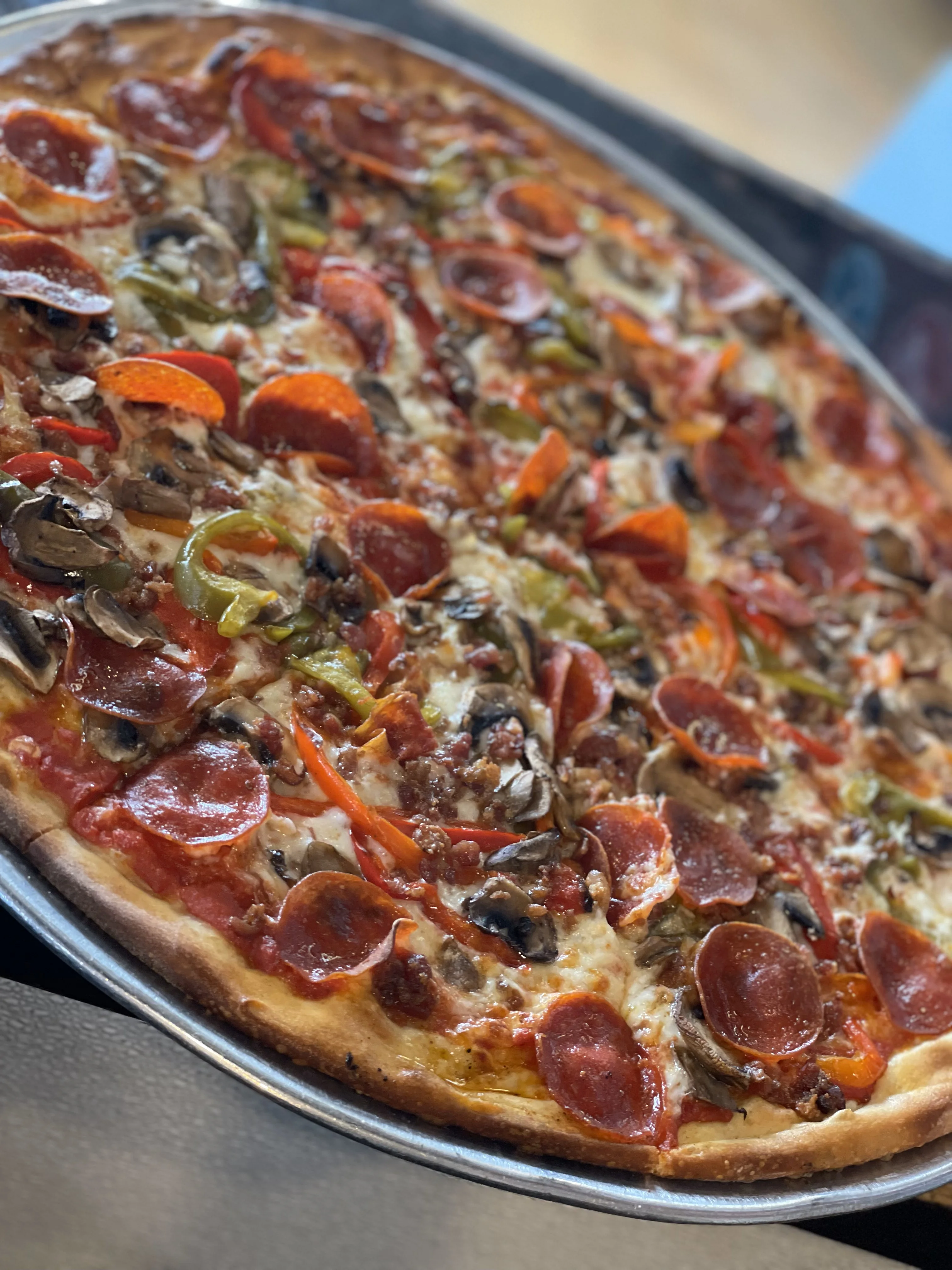 Loaded pepperoni pizza with vegetables