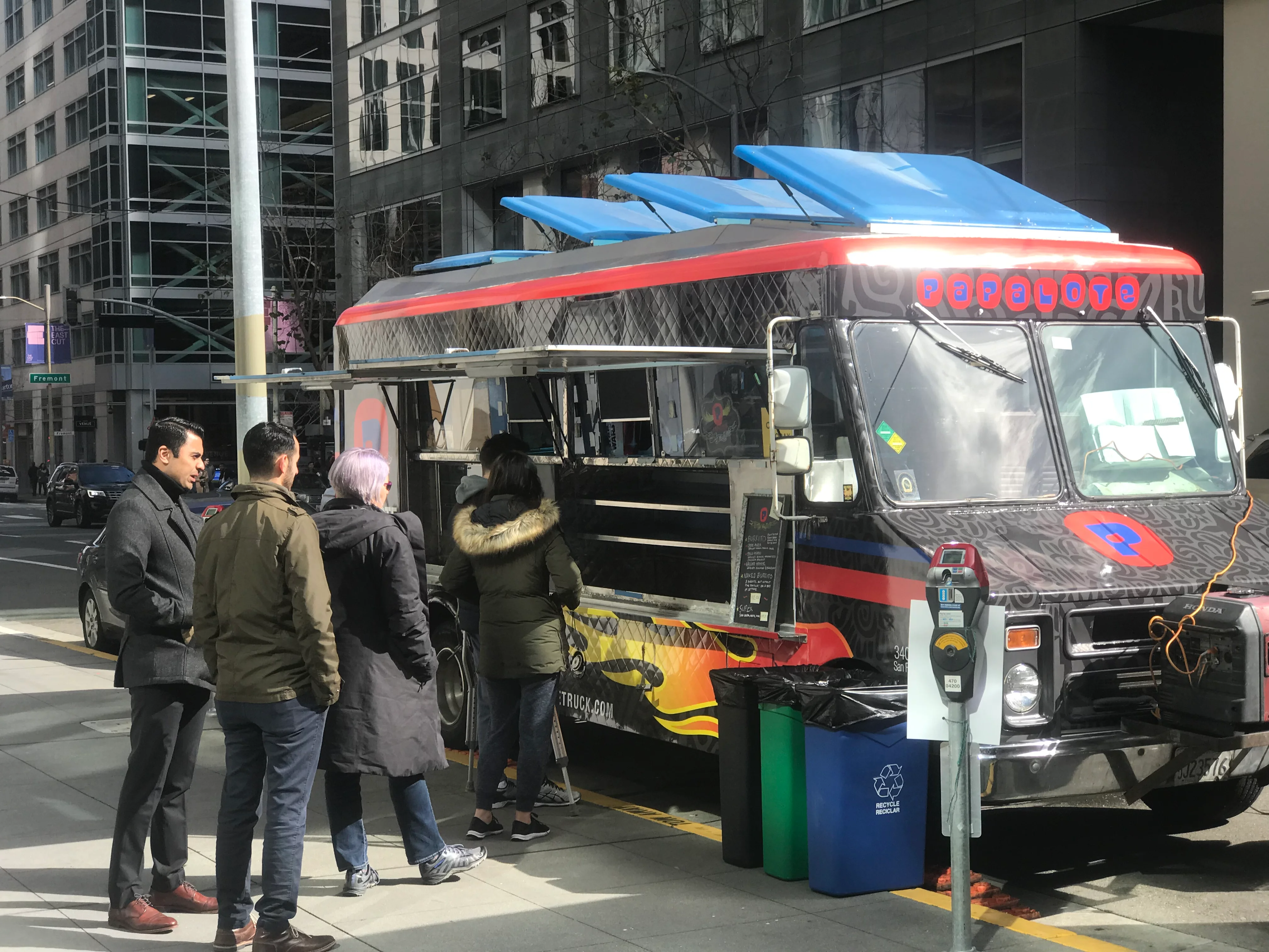 People ordering at the Papalote Truck at the First and Howard location.