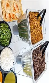 Mexican taco bar with seasoned meats and fresh toppings