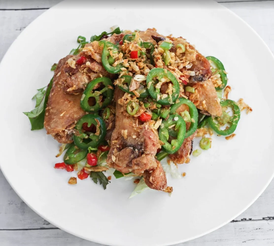 Crispy Vietnamese fried chicken with jalapeños and herbs