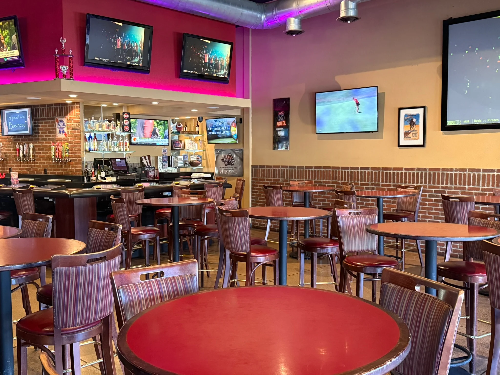 Cozy restaurant interior with bar and multiple TVs