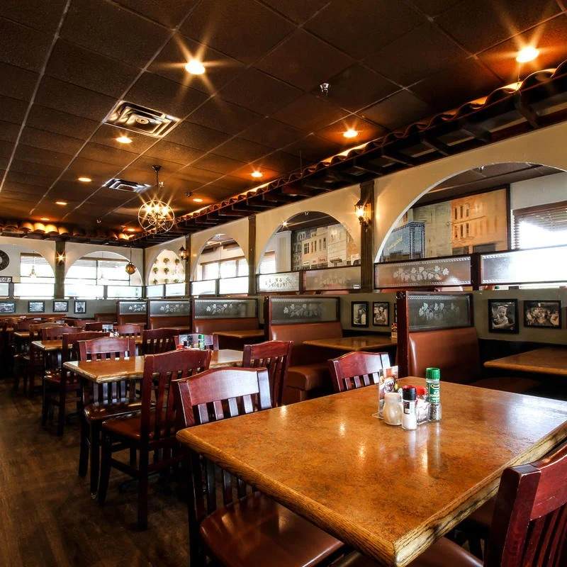Cozy restaurant interior with wooden tables and warm lighting