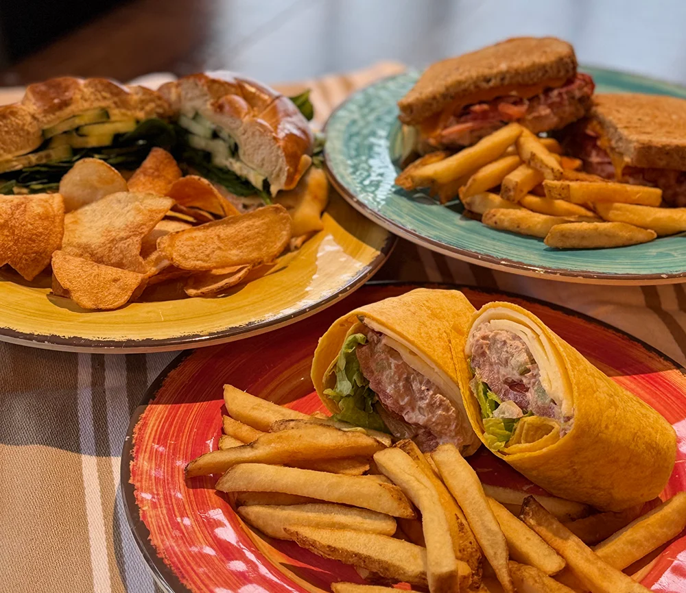 Fresh ingredients and homemade soups at Isaac's Craft Kitchen & Brewery, featuring shrimp, vibrant bell peppers, spinach, carrots, tomatoes, and artisanal ingredients. A farm-to-table selection highlighting produce and seafood.