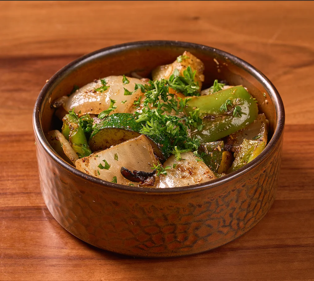 Sautéed mixed vegetables in a rustic bowl