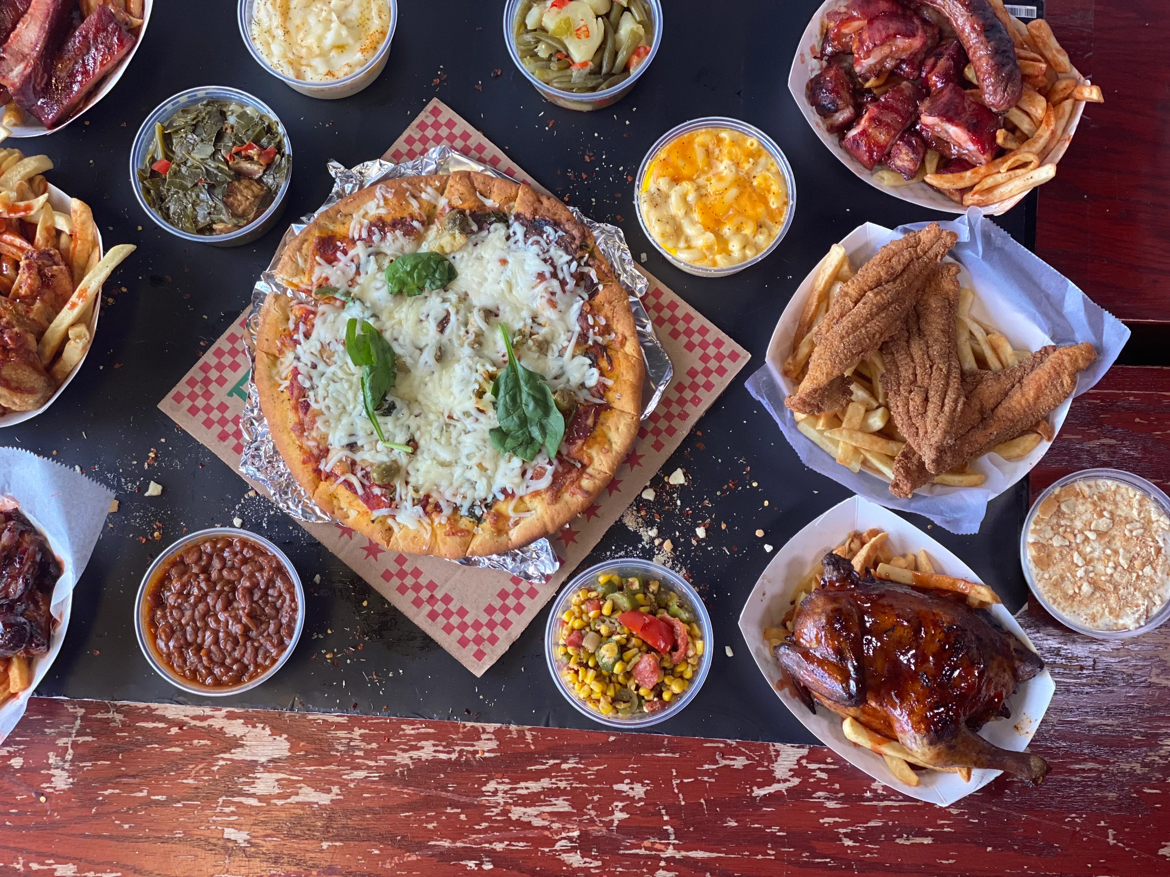 Southern barbecue platter with pizza and sides