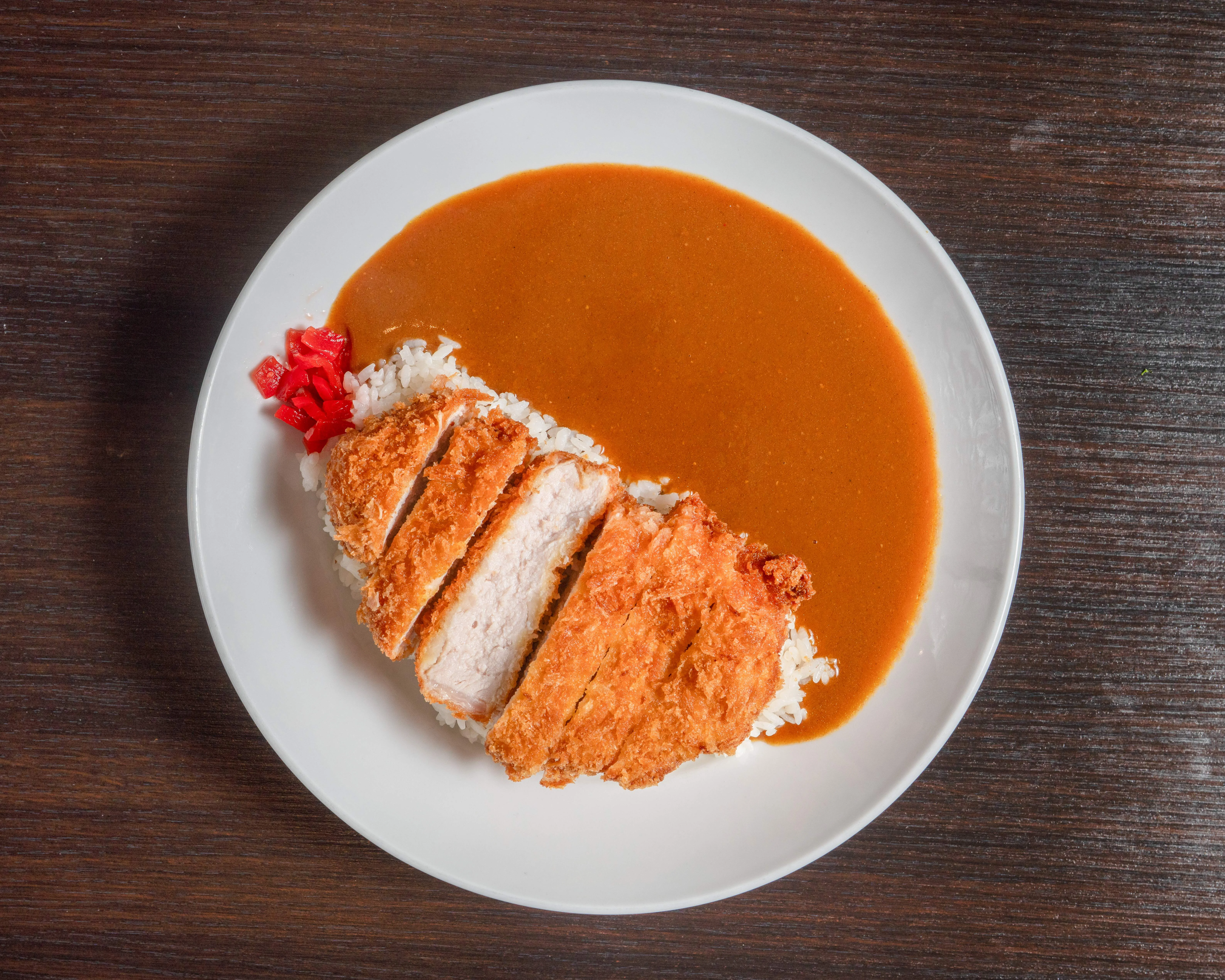 Japanese katsu curry served with rice and pickled vegetables