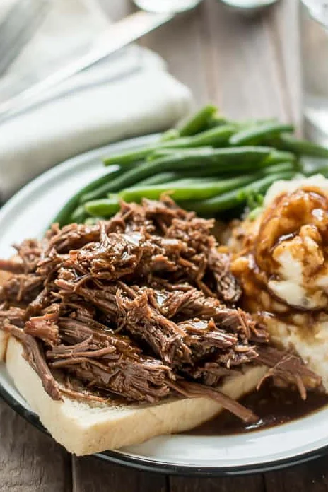 Tender shredded beef on toast with green beans and mashed potatoes