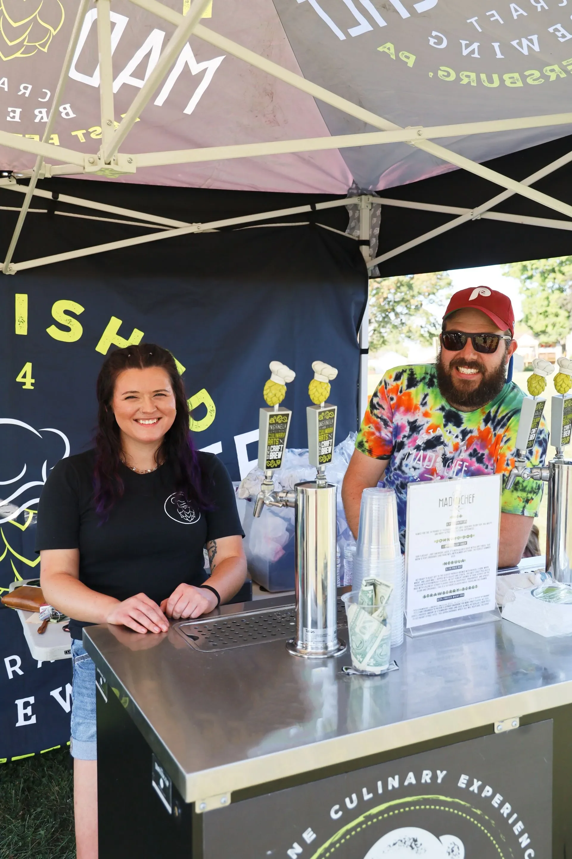 Craft beer stand with friendly staff at a food festival