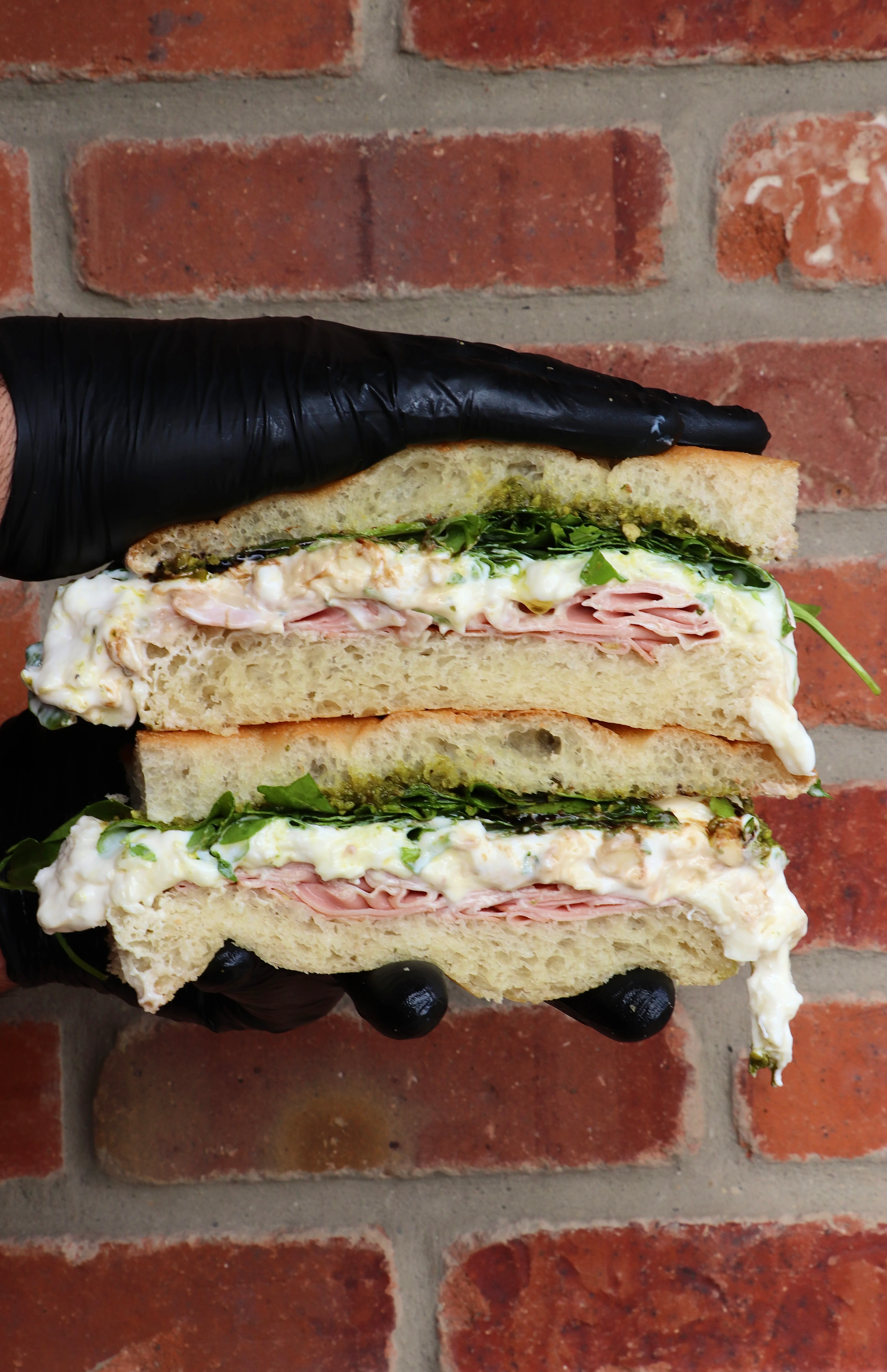 Close-up of a ham and lettuce sandwich on sliced bread