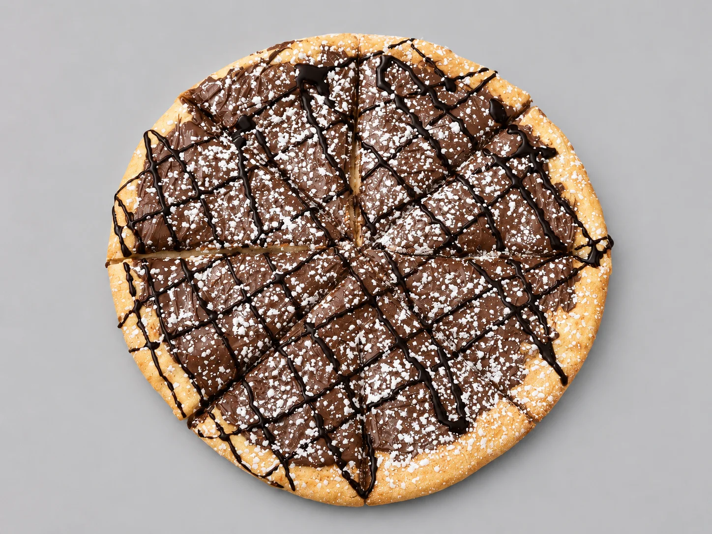 Decadent chocolate pizza drizzled with chocolate sauce