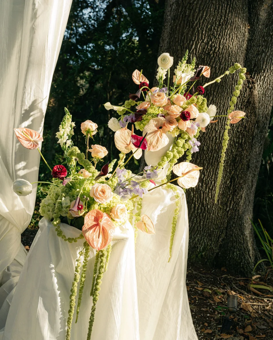 Elegant floral arrangement with pastel roses and greenery