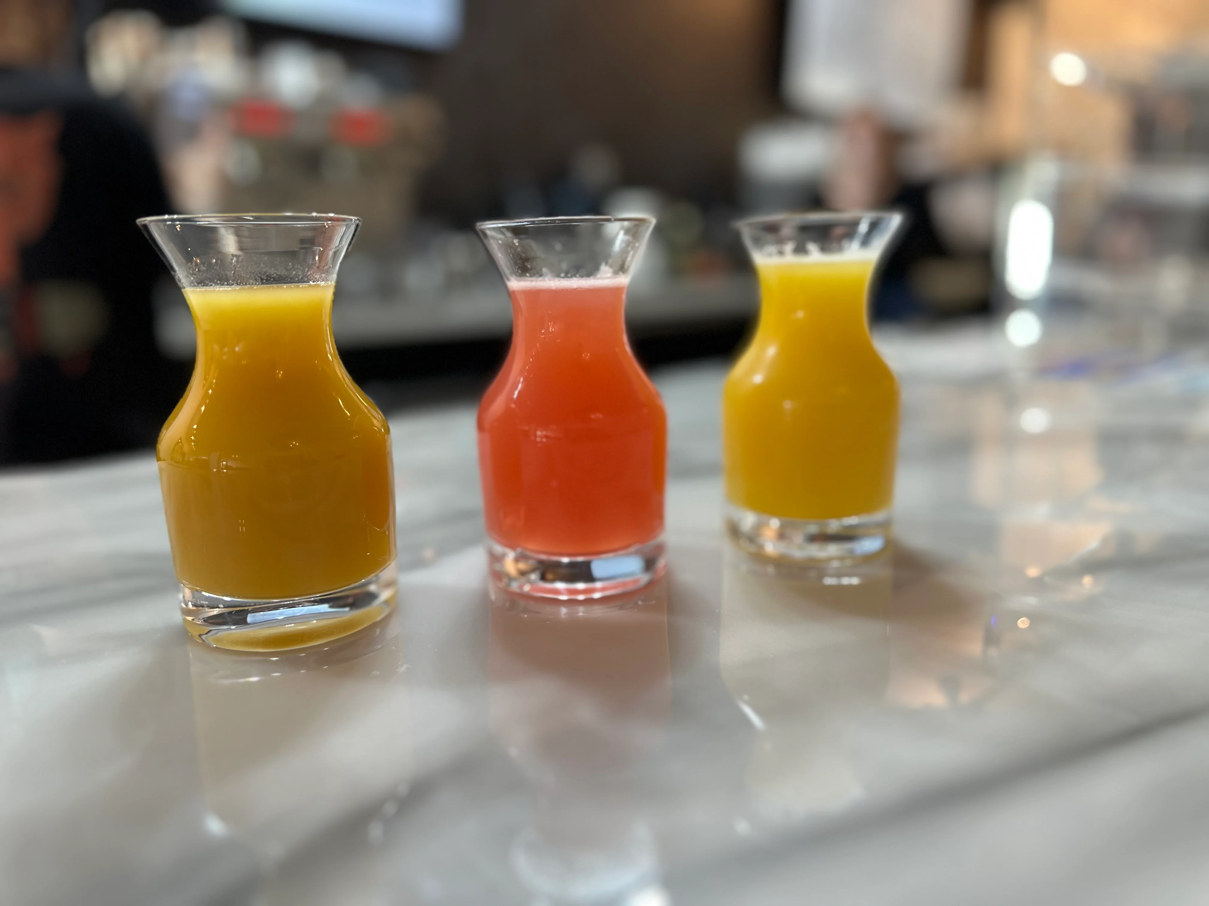 B-Side Coffee Bar’s Mimosa Flight featuring juice options of orange, cran-raspberry, mango tangerine, and pineapple in Huber Heights, Ohio.