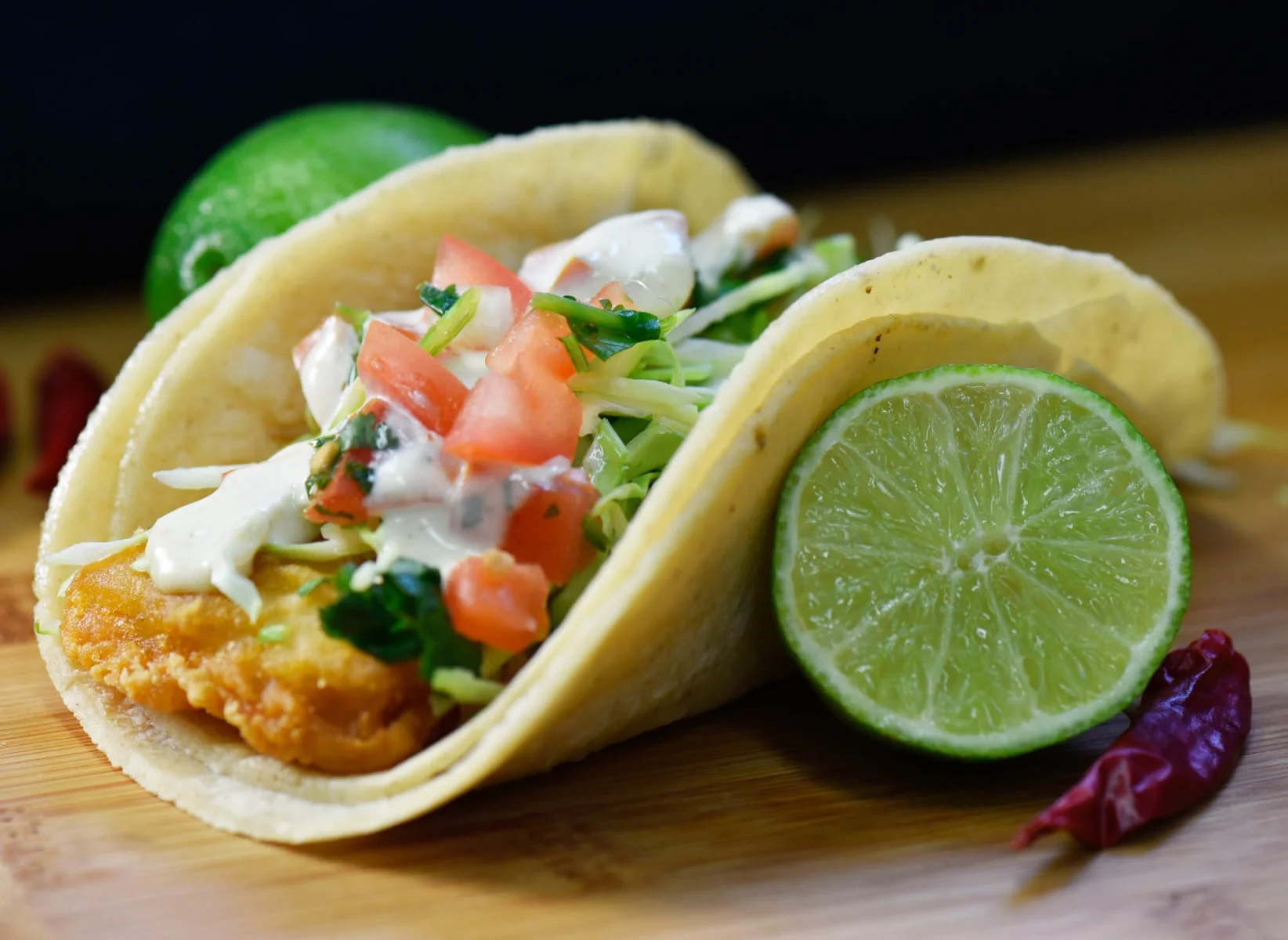 Crispy fish tacos with fresh toppings and lime