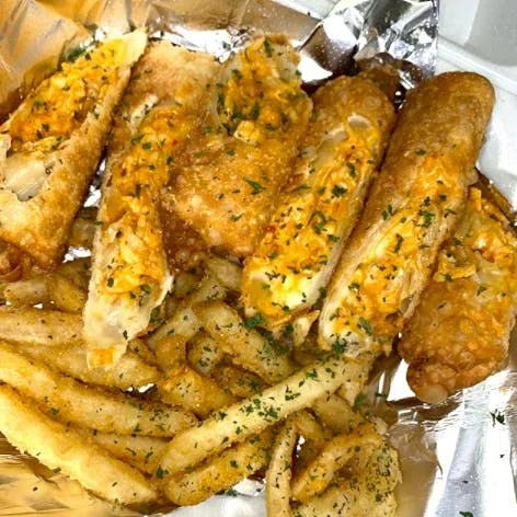 Crispy fried fish rolls with seasoned fries