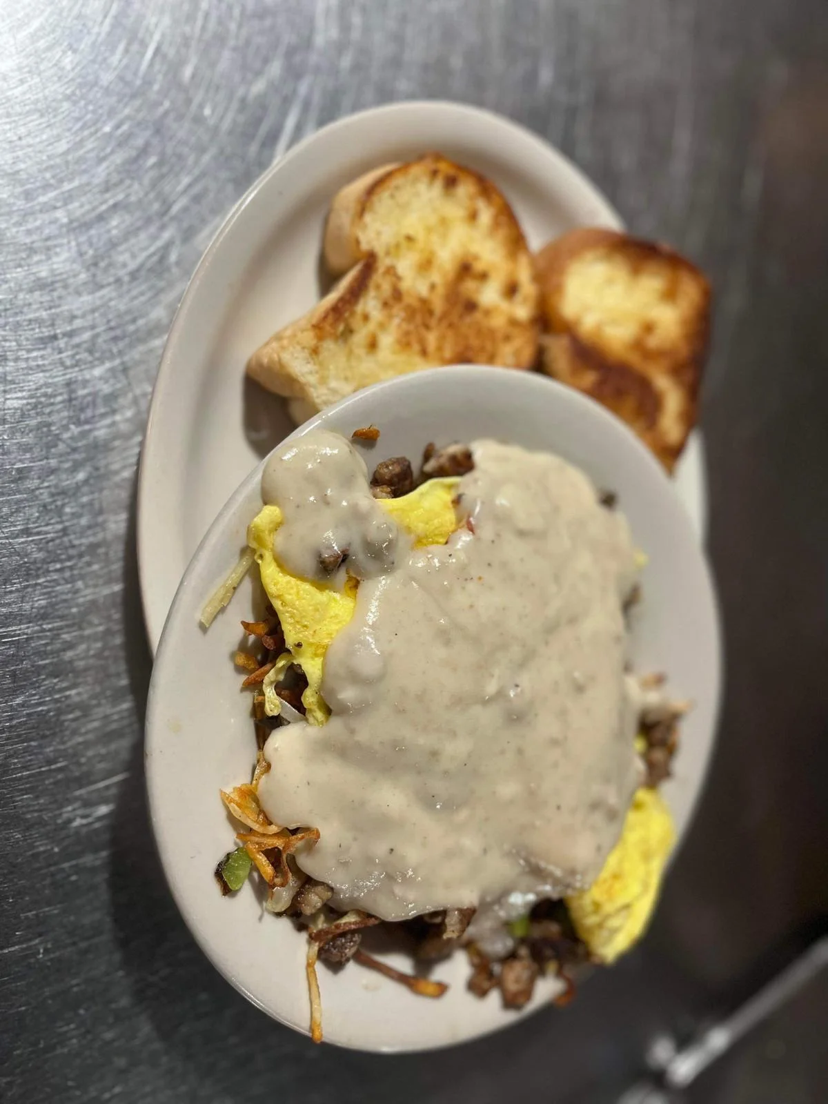 Southern-style biscuits and gravy with omelette and toast
