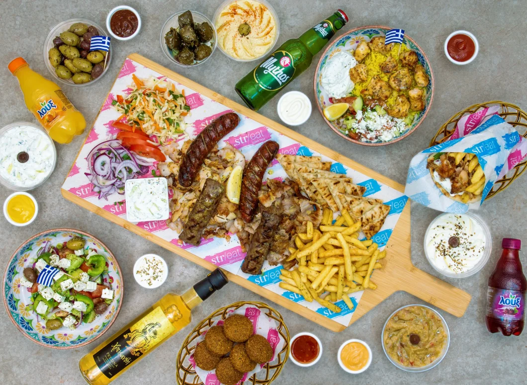Greek mixed grill platter with pita and sides