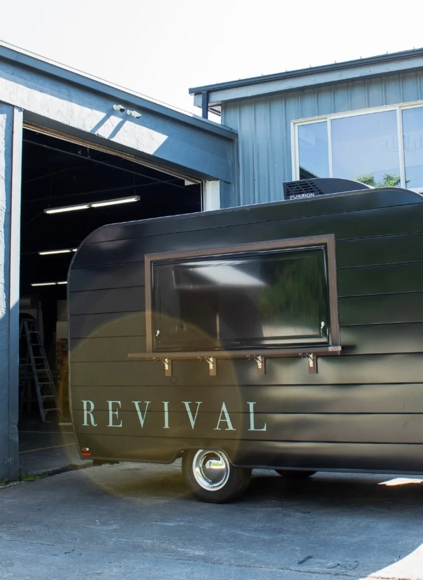 Modern food trailer with sleek design and large serving window